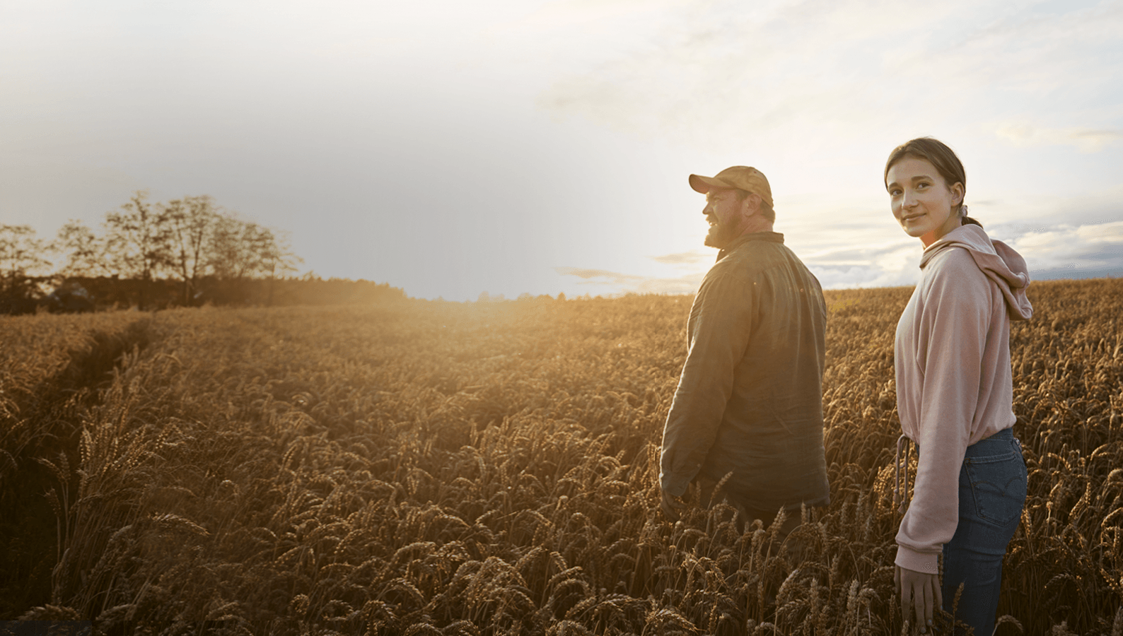 Farmer and daughter in the wheat field